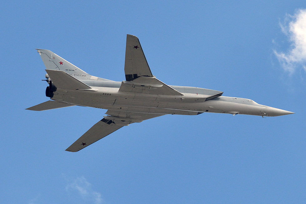 A Tu-22M3 banking away the long fuselage and twin engines are clear.