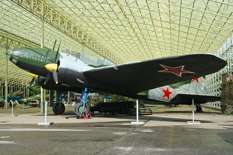 Side profile of a preserved Il-4 in green camouflage with red star.