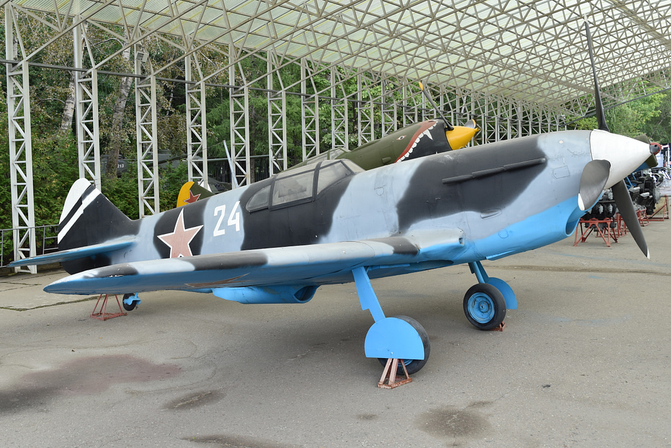 A restored LaGG-3 24 white at Victory Park, Moscow the types slab-sided wooden fuselage clear in the light.