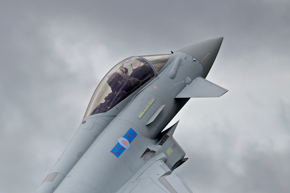 Inside the Typhoons glass cockpit sensor fusion and a helmet-mounted sight let one pilot fight at 9 g.