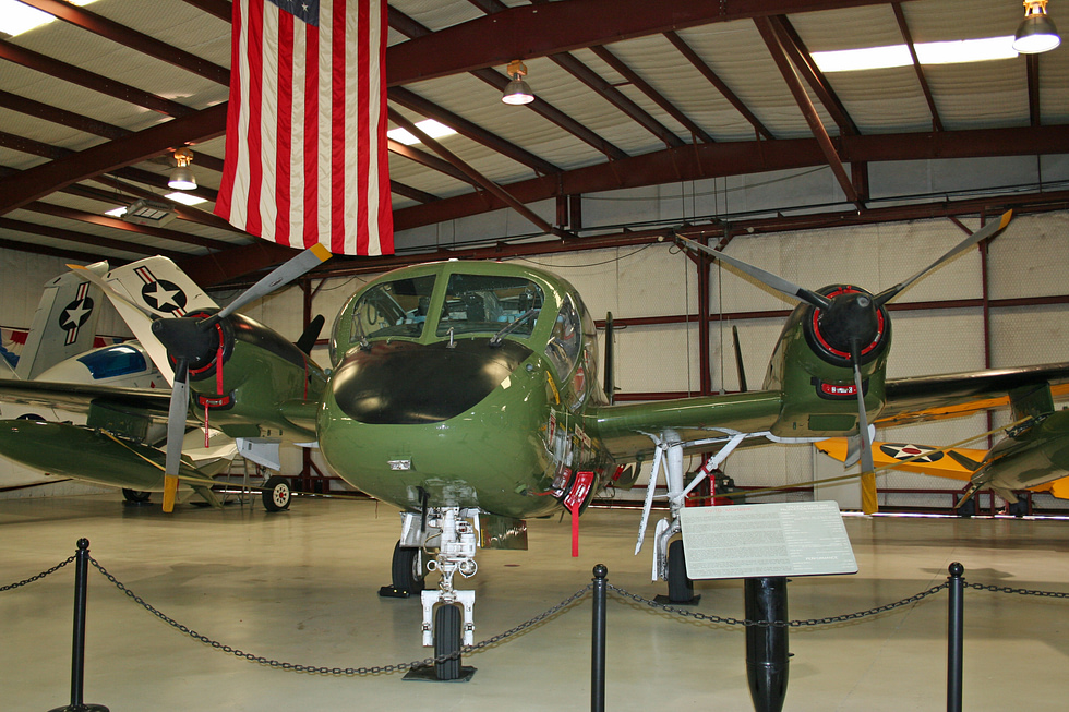 A restored Mohawk in Army camouflage, showing the distinctive triple tail.