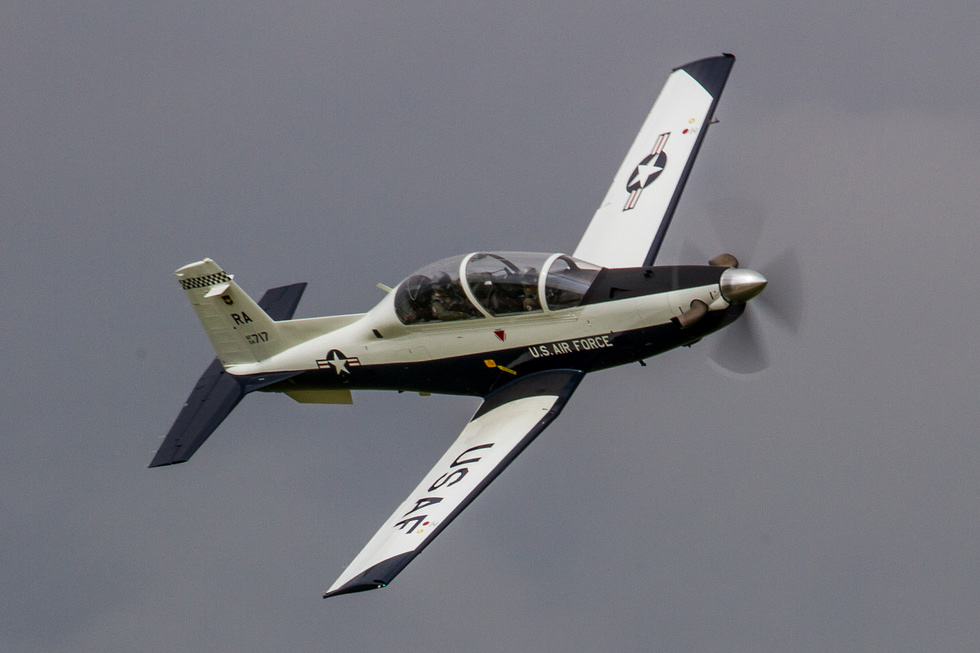 A T-6 Texan II performing a flying display the turboprop that trains new military pilots.