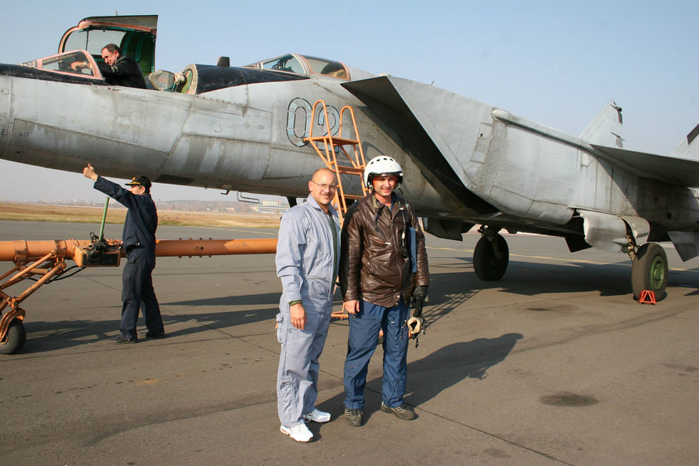 A MiGFlug customer and pilot standing in front of a two-seat MiG-25