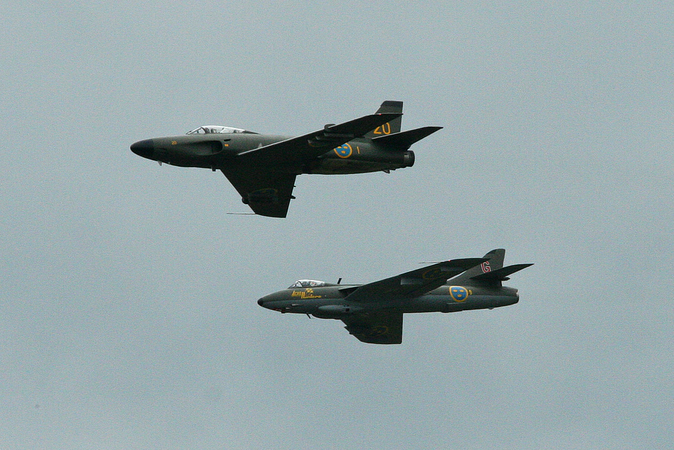 A J32E Lansen flying in formation with a Hawker Hunter at Malmen in 2012, the types final year in the air.