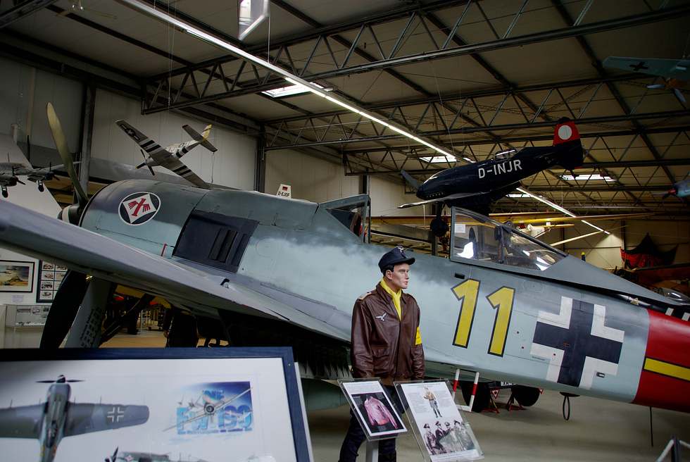 A Flug Werk Fw 190 reproduction in White 11 markings on museum display.