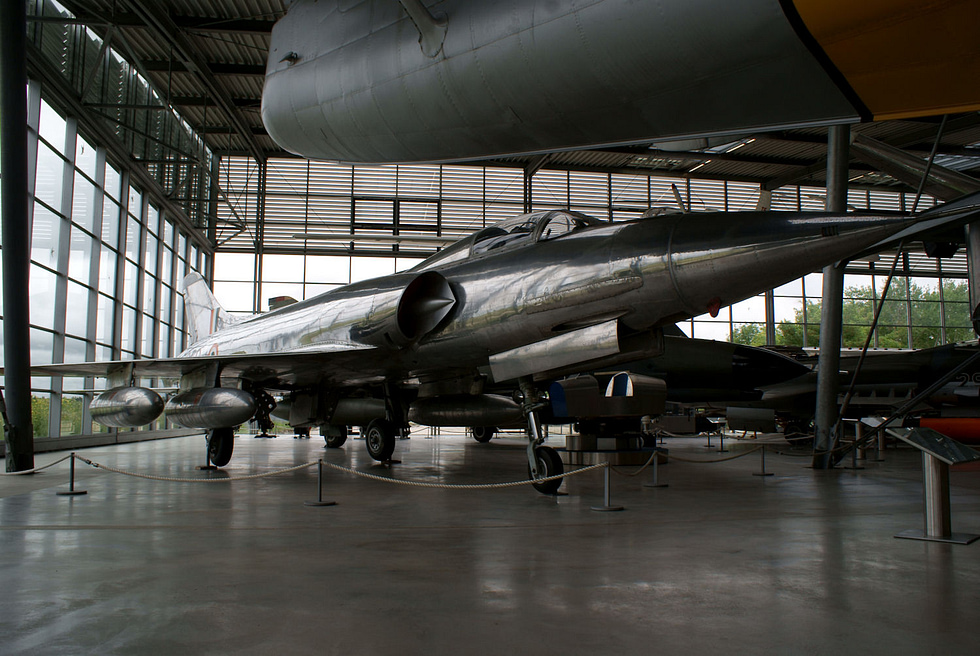A silver Marut Mk.I on museum display twin intakes and swept wing from the front quarter.