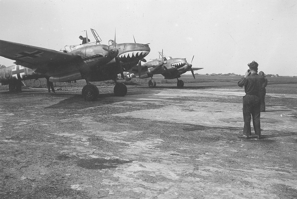 Two Bf 110s of ZG 76 with their distinctive shark-mouth markings, De Kooy airfield, 1941.