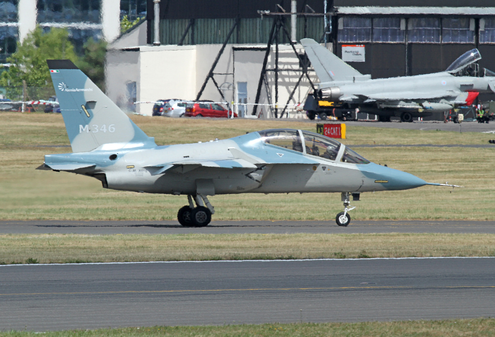 An M-346 taxis past a Eurofighter Typhoon the Master is a lead-in trainer for exactly this generation of fighter.