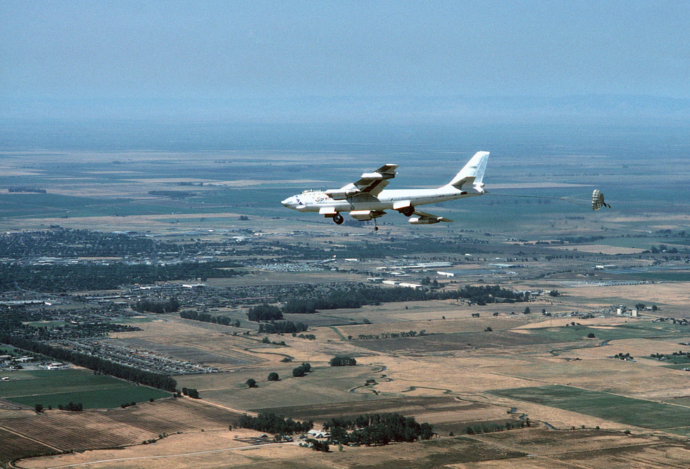 A restored B-47E with gear down and brake chute streamed how you slow a slippery jet.