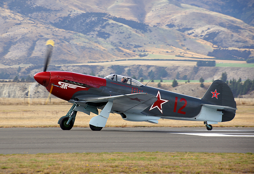 A restored Yak-3 on the runway in Soviet markings.