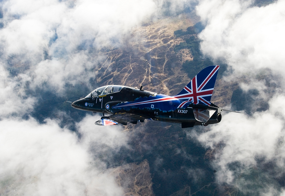 An RAF Hawk T1 high above RAF Valley, the home of British advanced flying training.