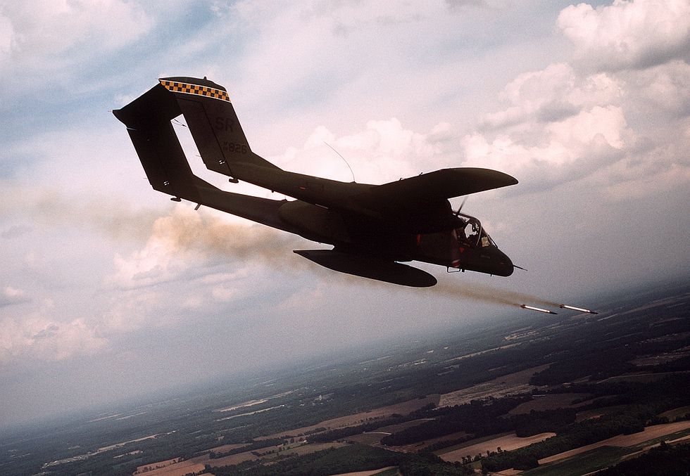 A USAF OV-10A firing 2.75-inch rockets in flight the Bronco in its light-attack role.