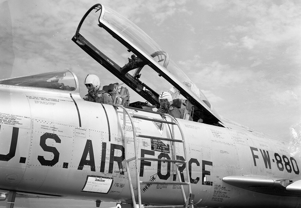 A two-seat F-100F with its canopy open the variant behind the Misty and Wild Weasel missions.