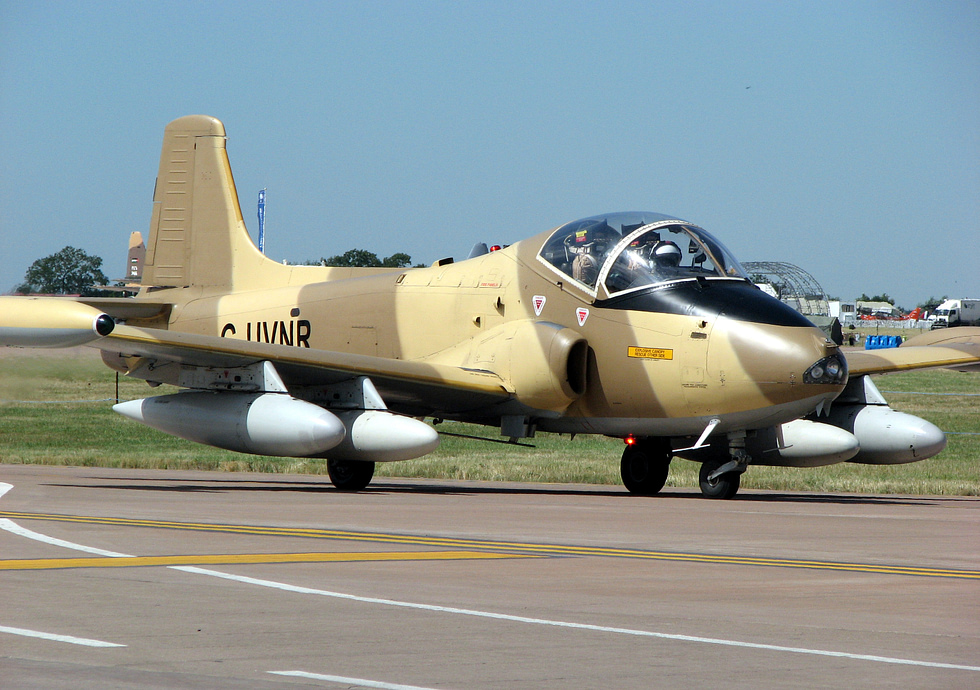 A Strikemaster Mk 87 taxiing the compact, purposeful shape of a rough-strip attacker.