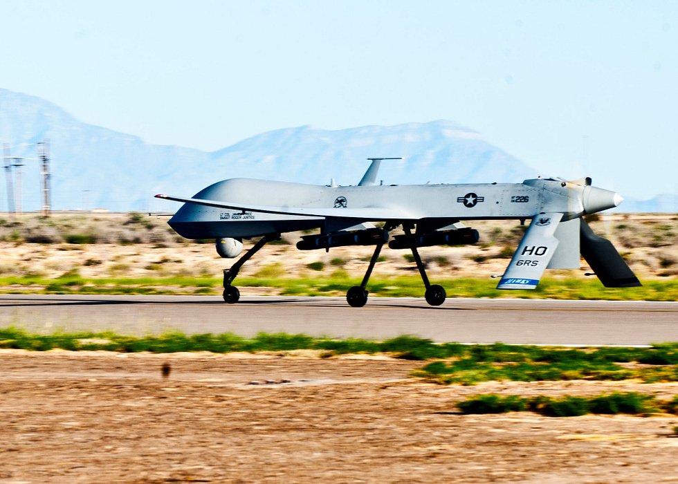 An MQ-1B Predator on the ramp, sensor ball under the nose.