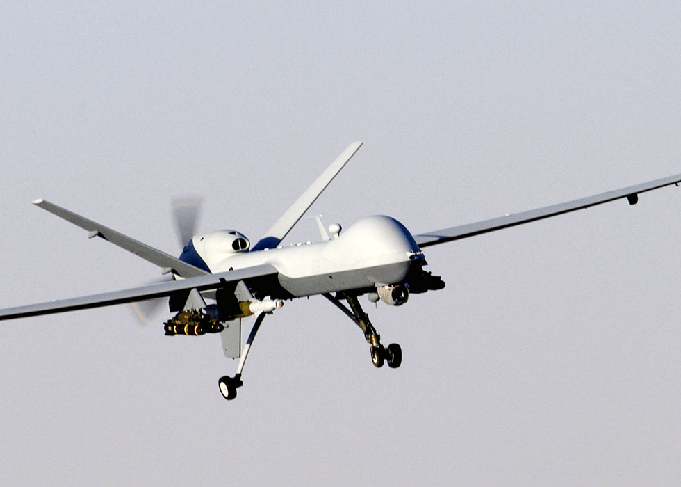 An MQ-9 Reaper in flight, returning from a mission note the long, high-aspect wing built for endurance.