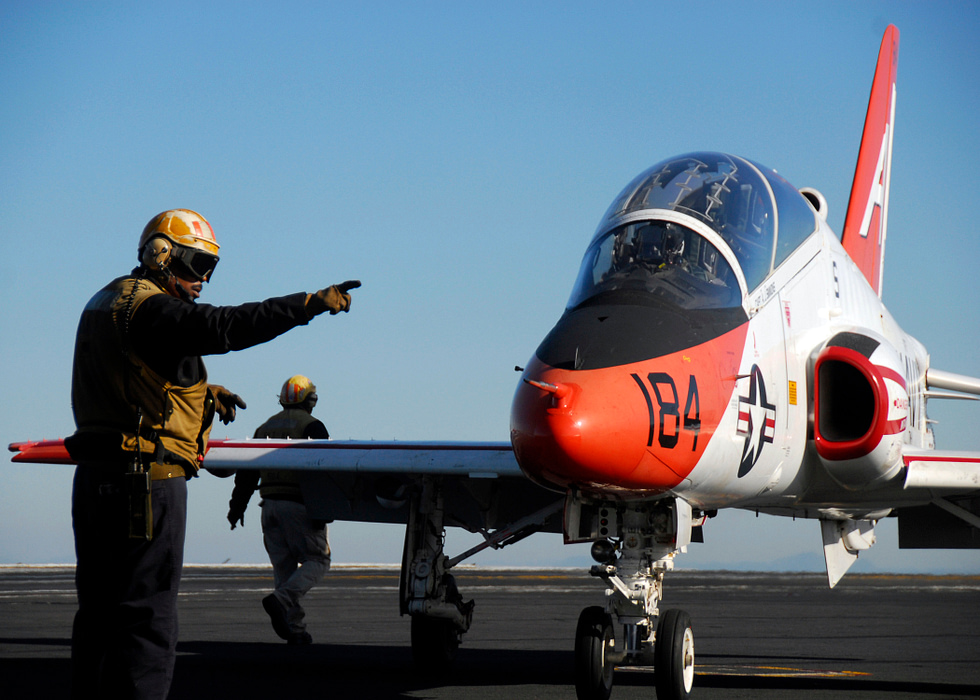 A Goshawk on the flight deck during carrier qualifications in the Pacific.