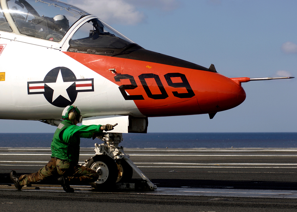A U.S. Navy T-45 Goshawk in flight over the Atlantic subsonic, unarmed, built to teach.