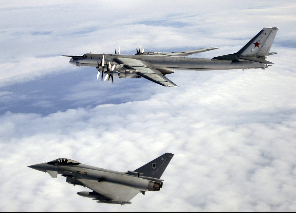 An RAF Eurofighter Typhoon shadows a Russian Tu-95 Bear on Quick Reaction Alert the jets daily air-policing work.