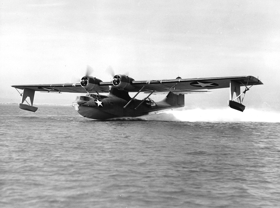 A PBY-5 Catalina flying boat lifting off the water in 1943.