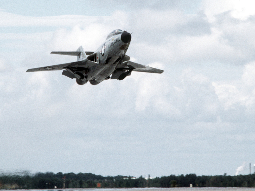 An F-101B Voodoo lifts off from Tyndall AFB in 1980 on its two afterburning J57 engines.