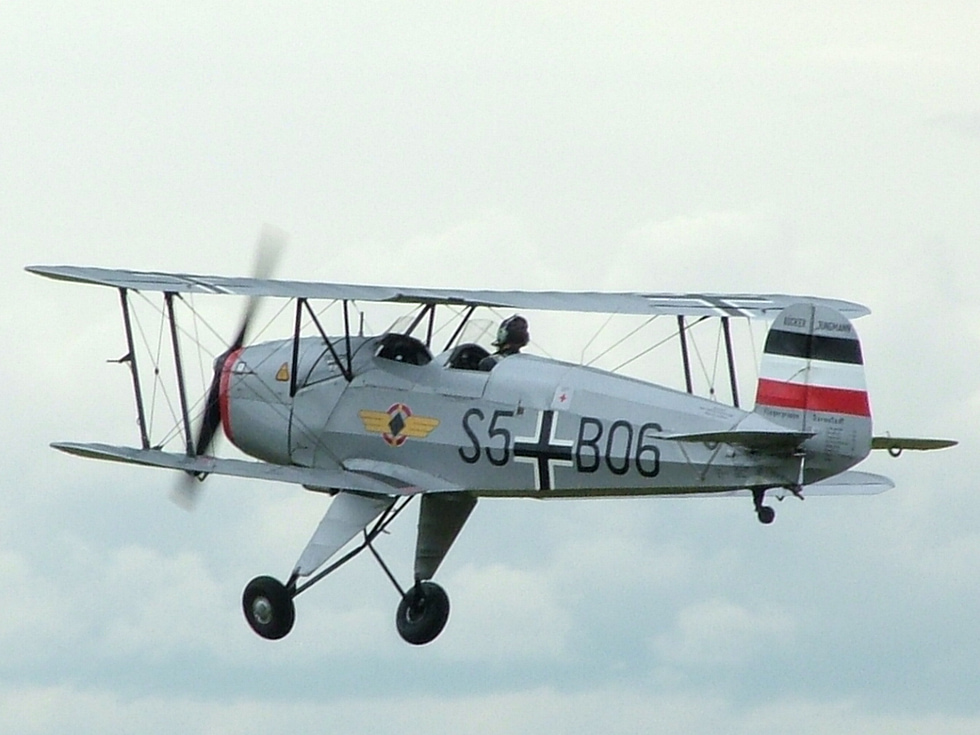 A restored Bücker Bü 131 Jungmann in flight light, slow and beautifully balanced.
