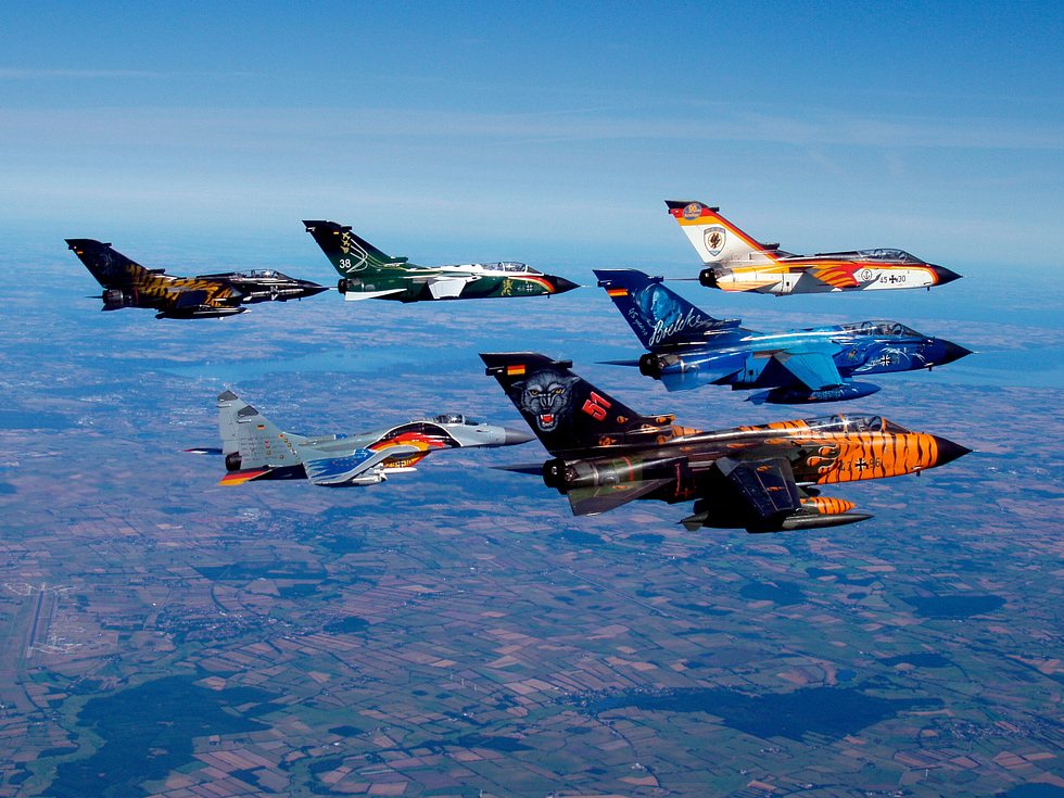 Panavia Tornados in formation wings spread for slow flight, showing the variable-geometry hinge.
