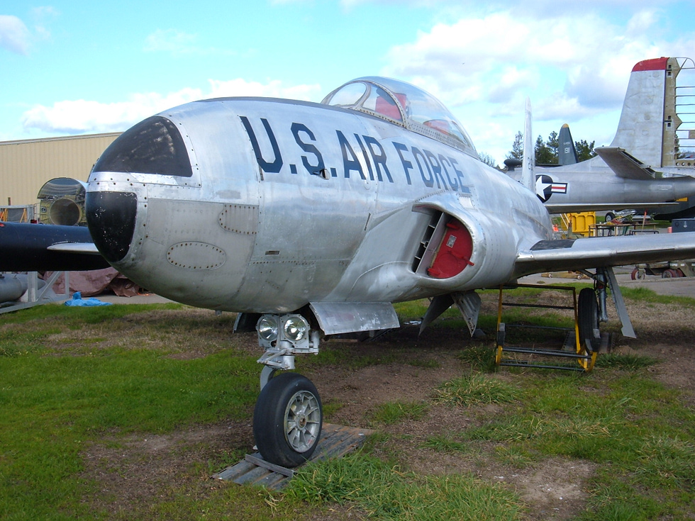 A T-33A Shooting Star on display at the Pacific Coast Air Museum, tip tanks and all.