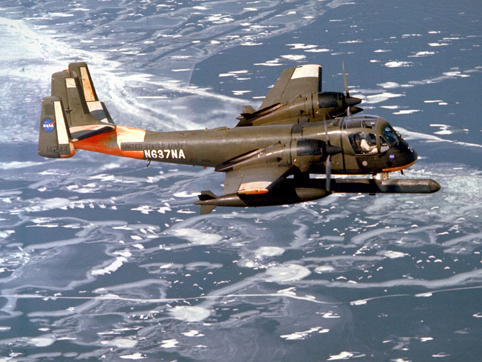 An OV-1B Mohawk, its side-looking radar canoe under the fuselage, on a mapping flight.