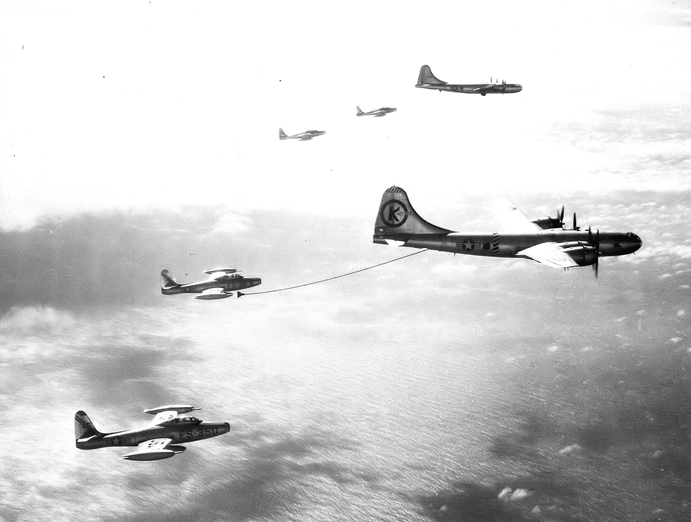 An F-84 takes on fuel from a KB-29 tanker the capability that made record crossings possible.