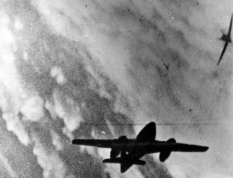 A wartime photograph of an Me 262 and a P-51 Mustang manoeuvring over Germany, late 1944.