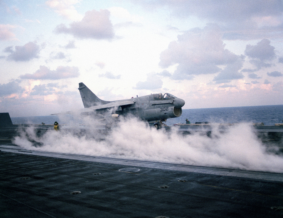 An A-7 hurled off the deck of USS Dwight D. Eisenhower on the catapult, 1983.