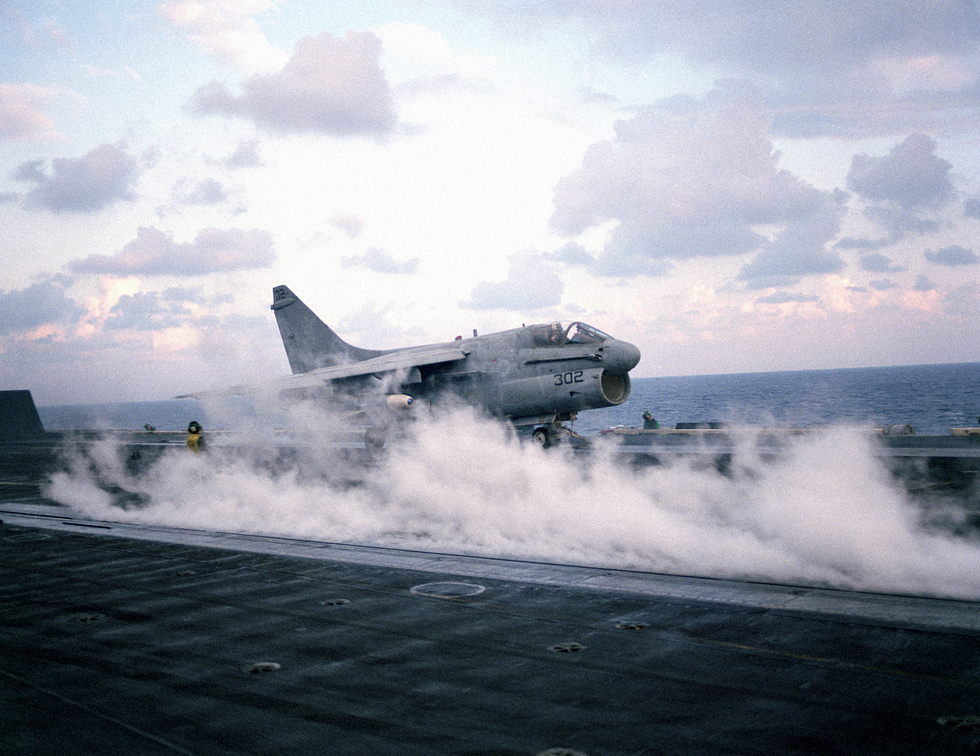 An A-7 hurled off the deck of USS Dwight D. Eisenhower on the catapult, 1983.