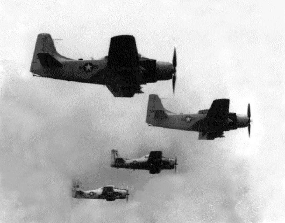VNAF T-28D Trojans and Douglas A-1E Skyraiders in formation over Vietnam, 1964.