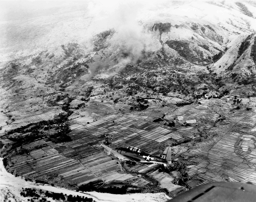 A bomb-laden Dauntless on a mission over Luzon in the Philippines, 1945.