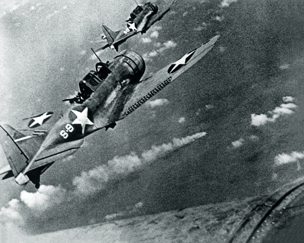 SBDs of VS-8 circle the burning Japanese cruiser Mikuma at Midway, 6 June 1942.
