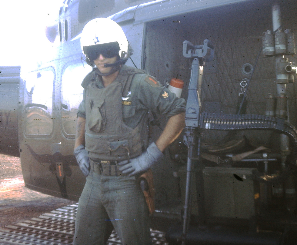 A Huey door gunner at his M60 one of the enduring images of the Vietnam War.