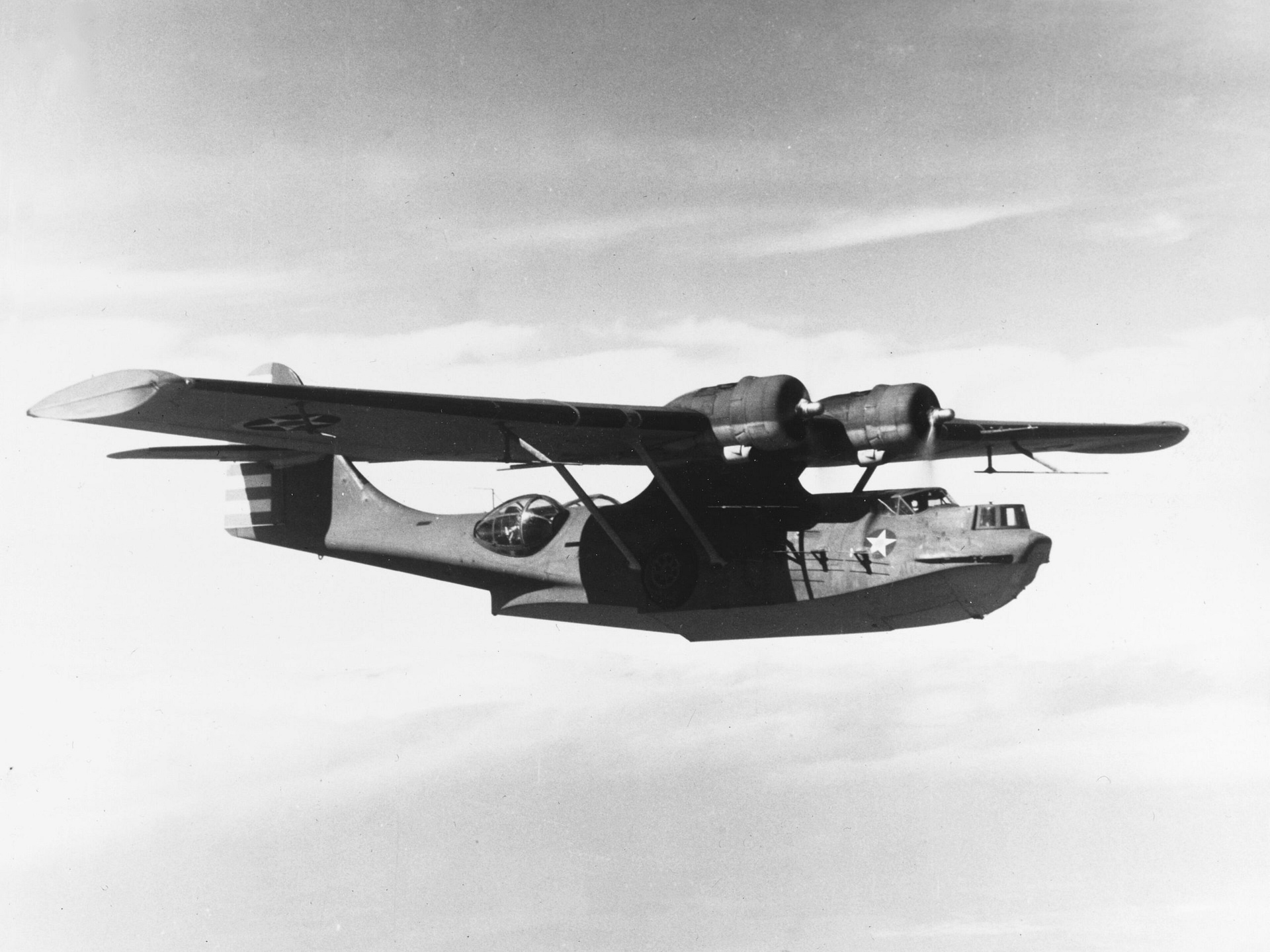 Consolidated PBY-5A Catalina amphibious flying boat in flight over water