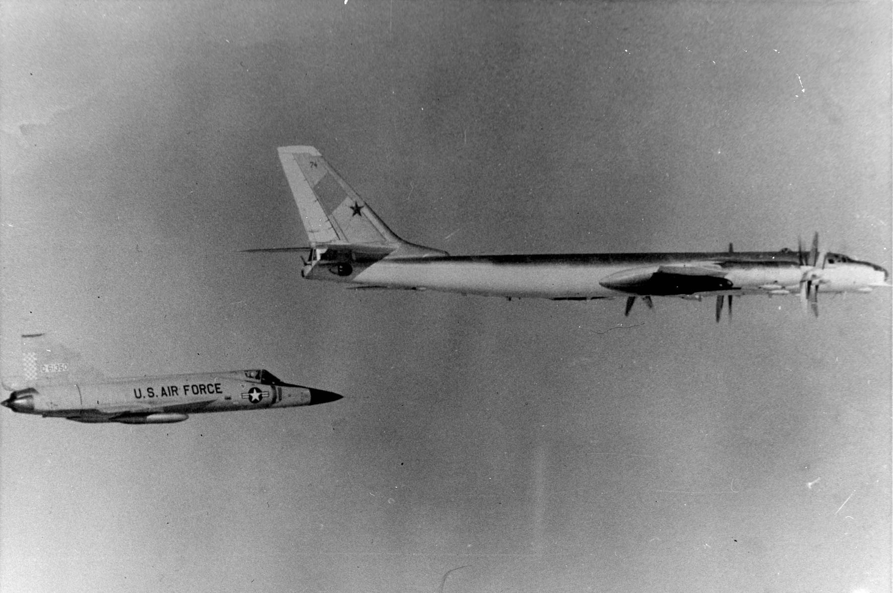 Convair F-102A Delta Dagger interceptor shadowing a Soviet bomber