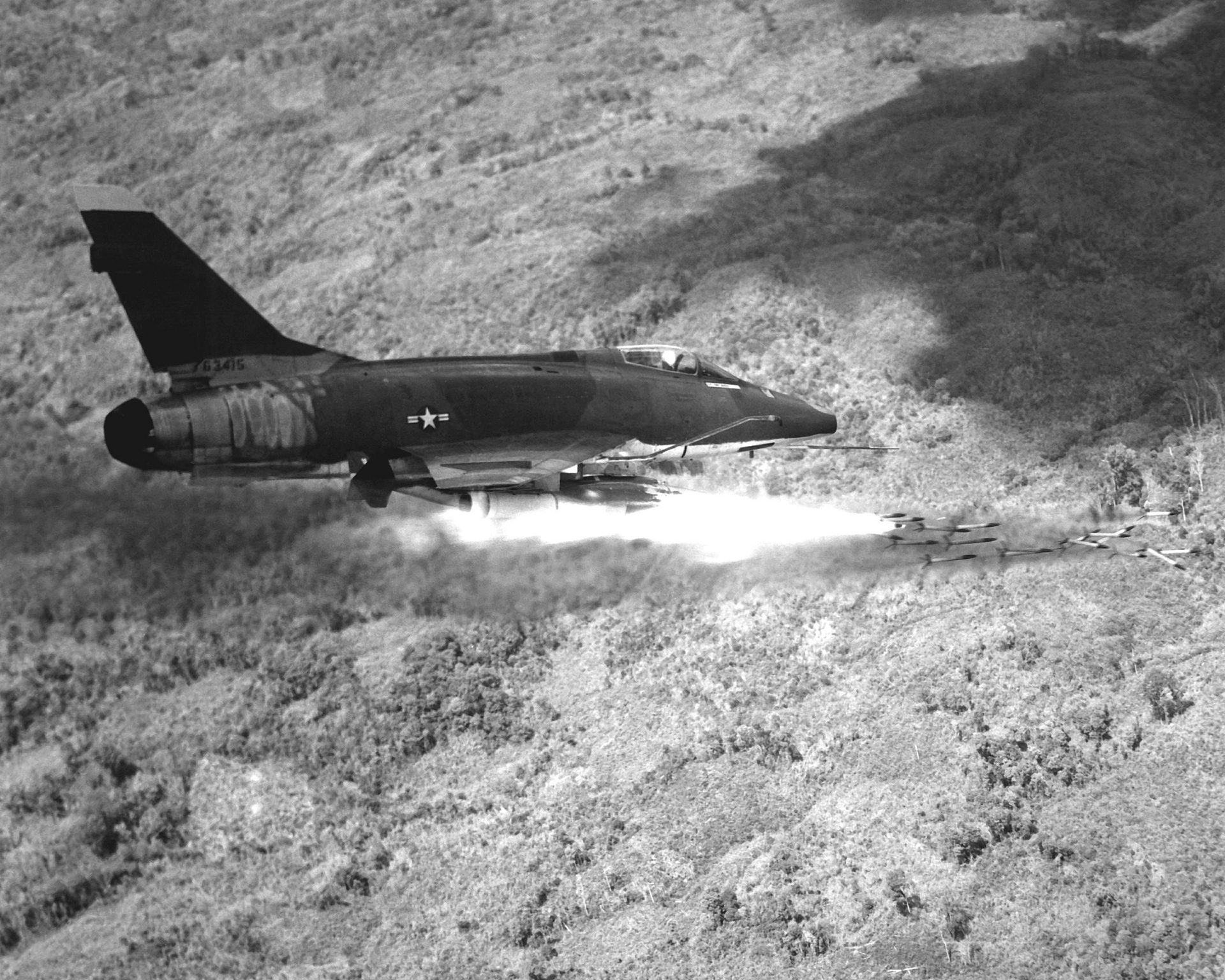 North American F-100D Super Sabre firing rockets over South Vietnam