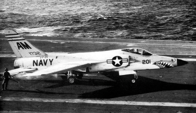 A VF-21 Tiger spotted aboard USS Ranger (CVA-61), 1957 folded, thin wings clear the crowded deck.