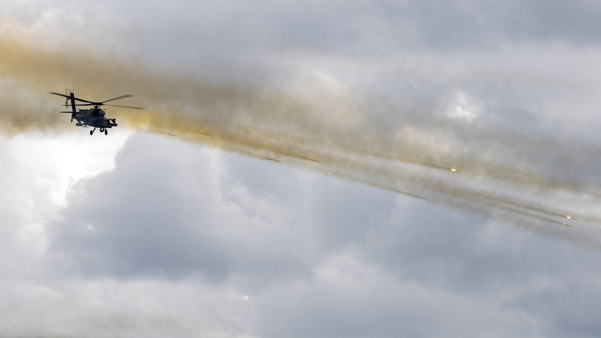 AH-64 Apache firing Hydra 70 rockets