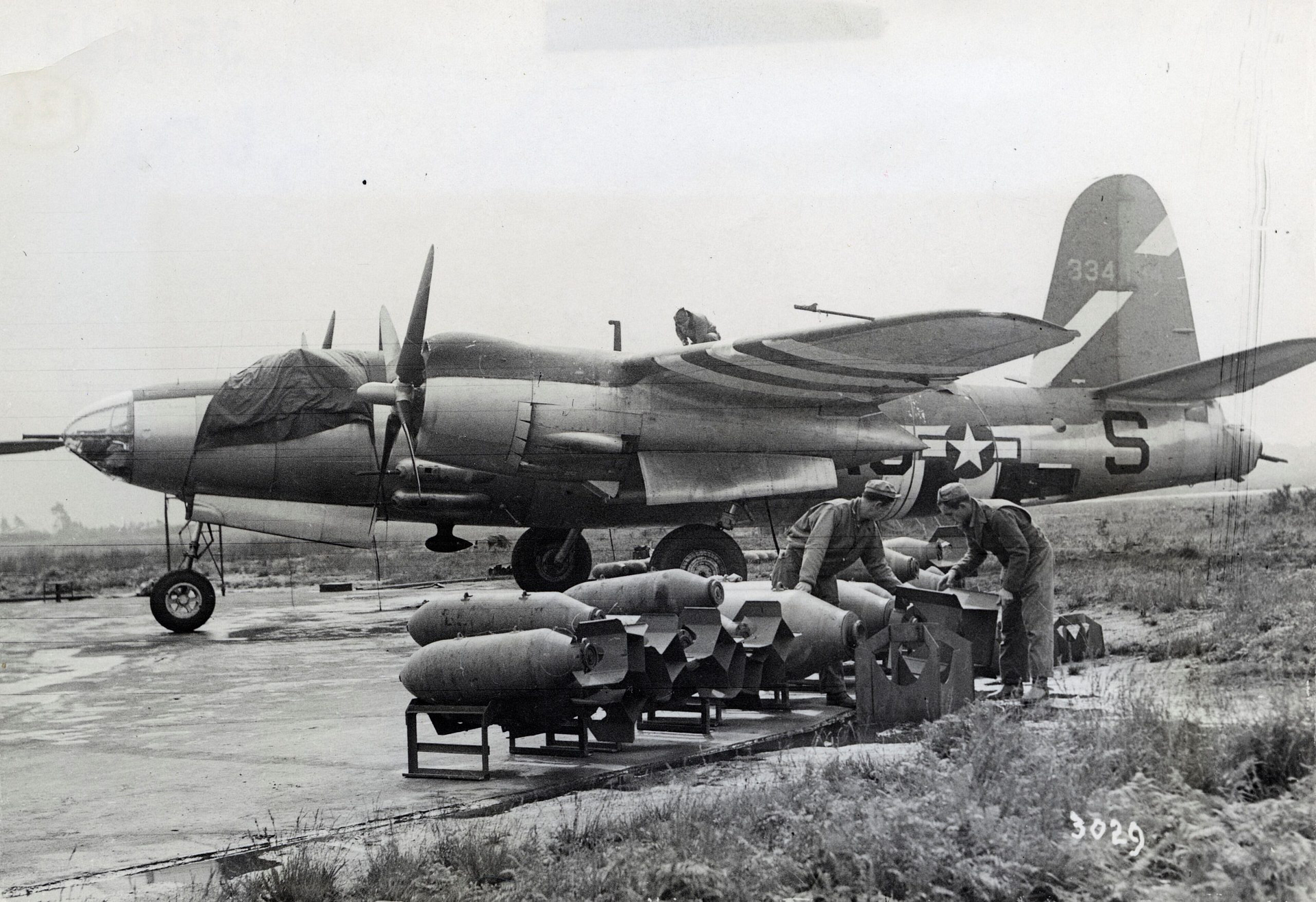 Ground crew loading bombs into a B-26 Marauder of the 394th Bomb Group