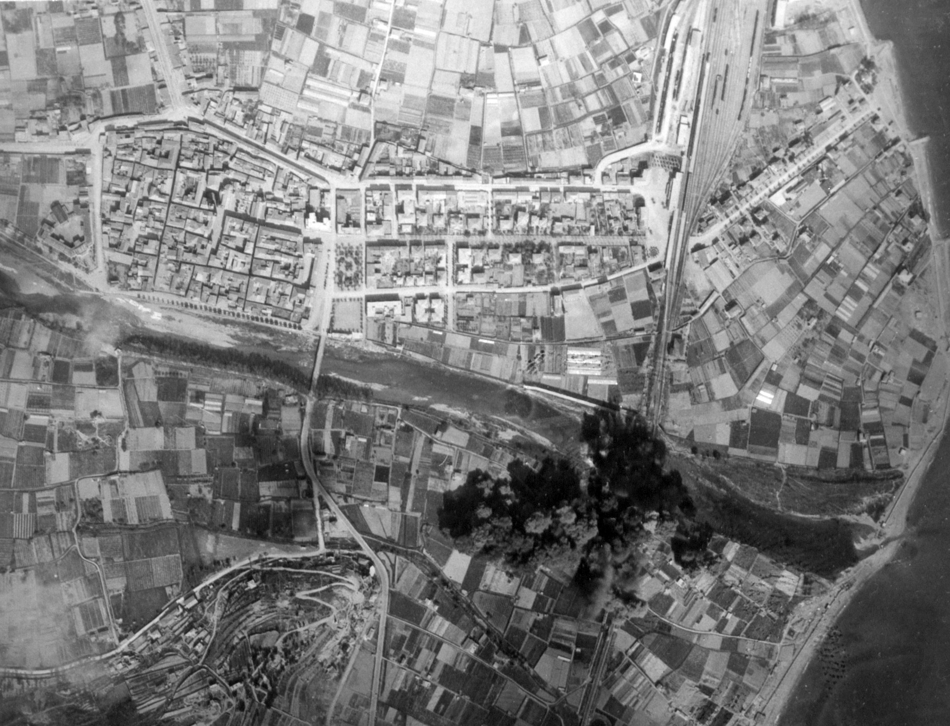 B-26 Marauders of the 320th Bomb Group bombing the Albenga railway bridge in Italy, 1944