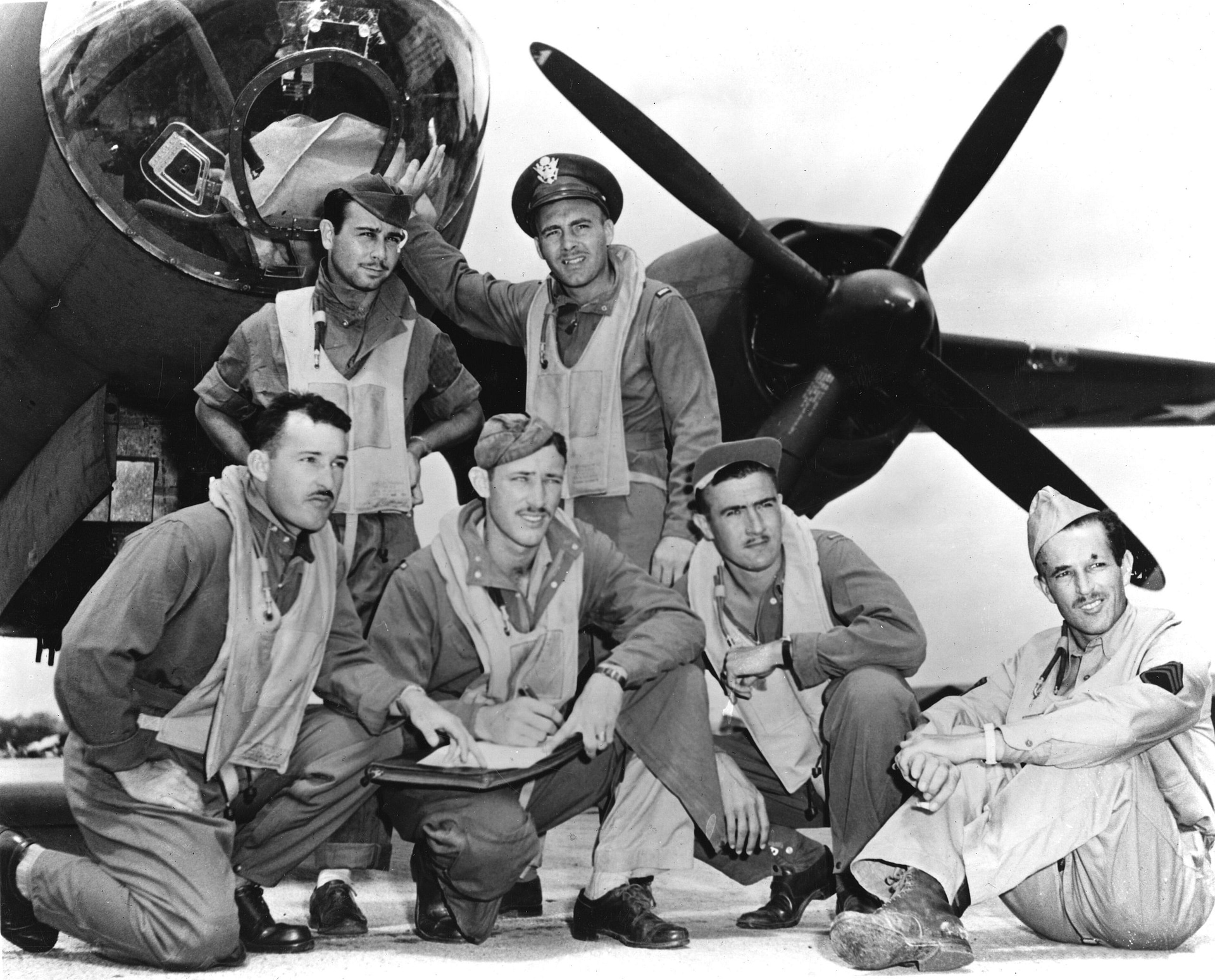 Crew of Lt James Muri with their battle-damaged B-26 Marauder after Midway, 1942