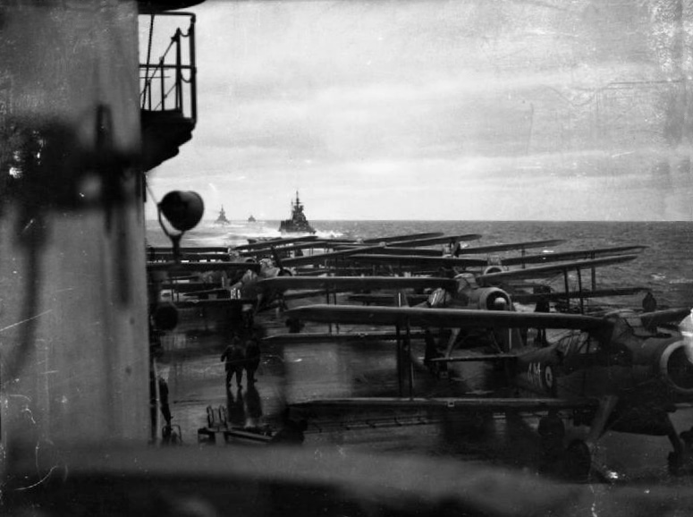 View from the search-light platform over the flight deck of HMS Victorious with Albacores ranged aft, 1944. Photo: Lt C. H. Parnall, RN official photographer — IWM (public domain).