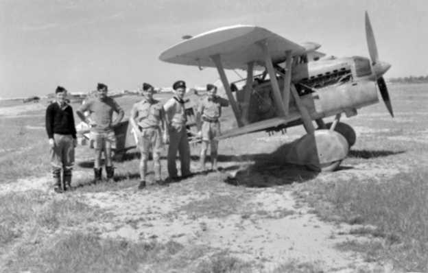 RAAF officers inspect a captured Fiat CR.32 at Benghazi in 1941
