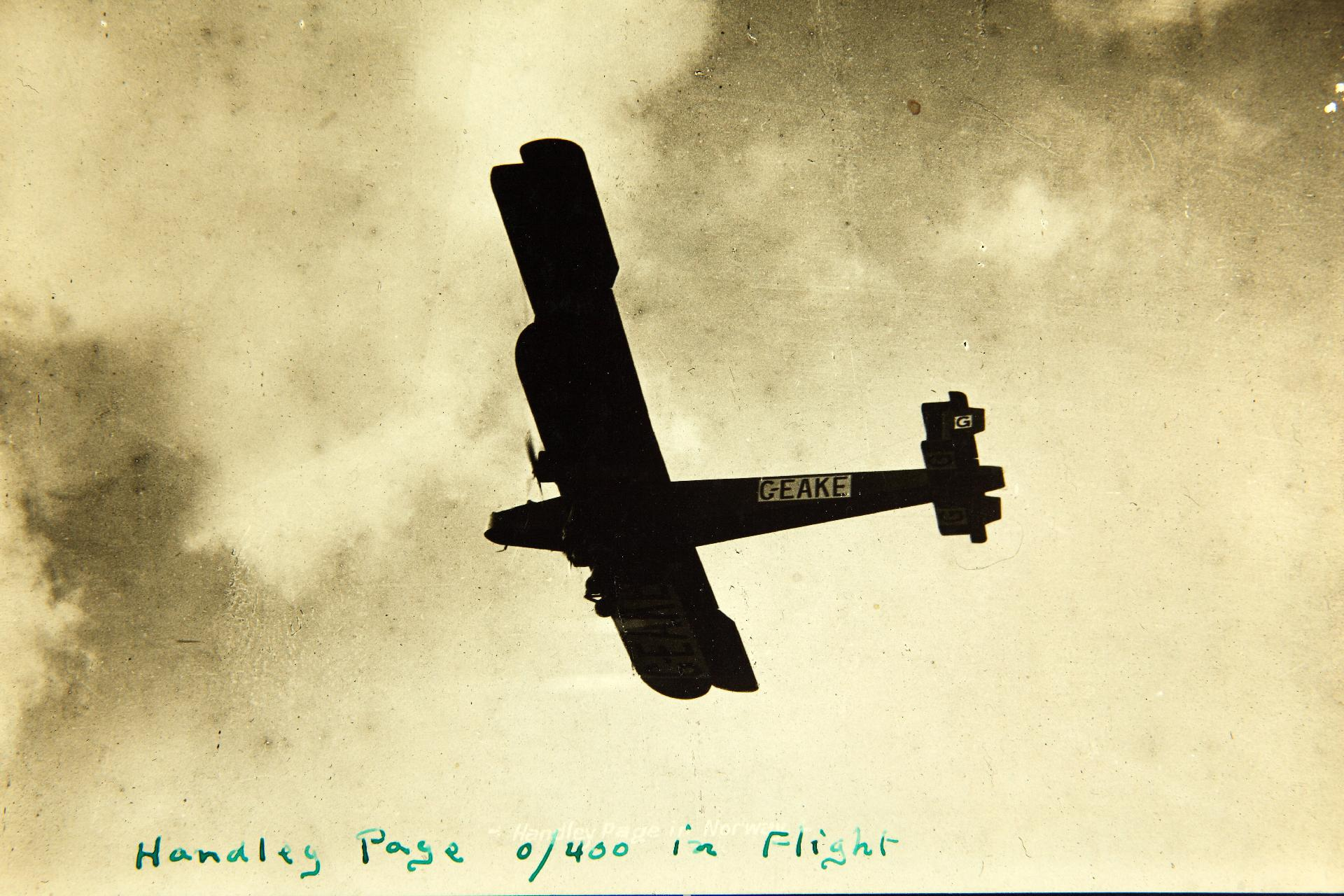 A civil O/400-type transport (G-EAKE) in flight, an early airliner conversion.