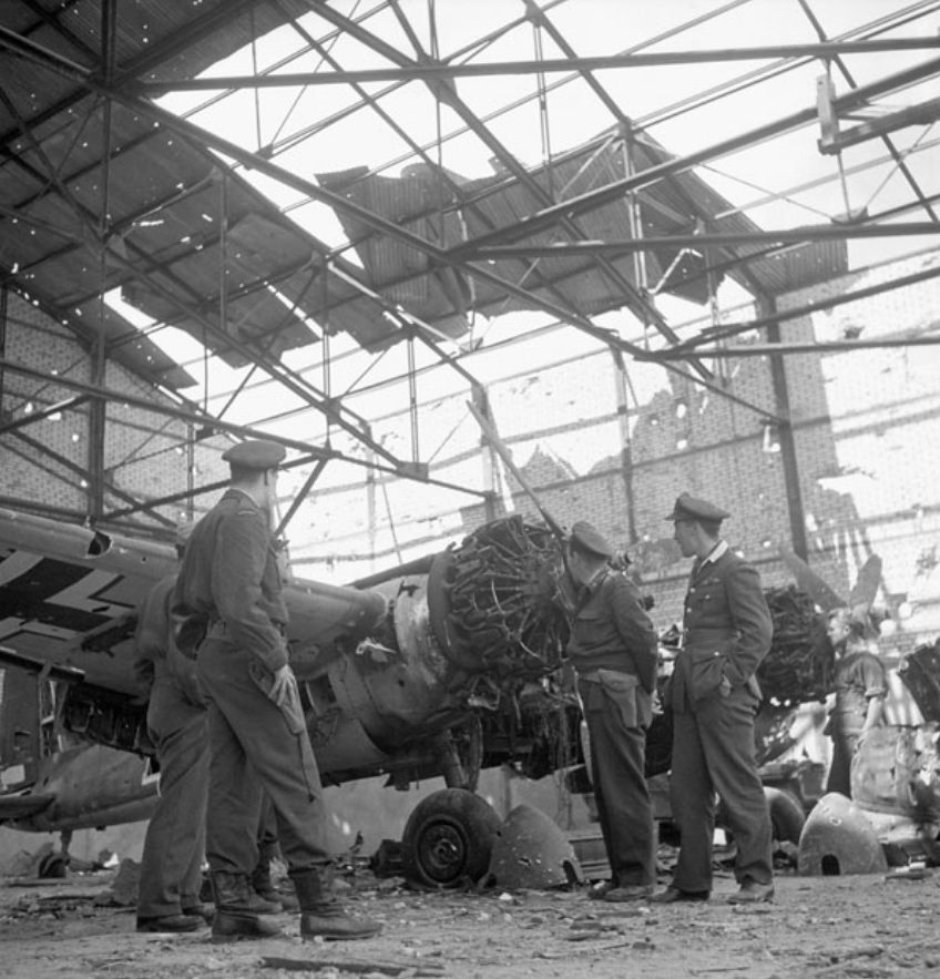 Canadian officers examine a captured Henschel Hs 129 at Carpiquet airfield, 1944.