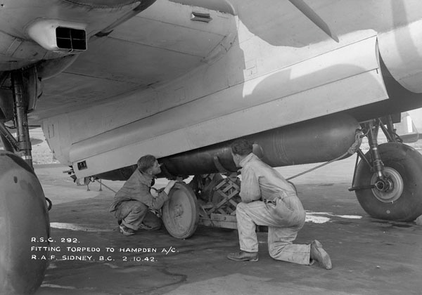 Ground crew loading a torpedo into a Handley Page Hampden